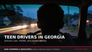 Teen driver hands on a steering wheel at dusk on a Georgia road