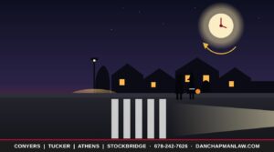 Trick-or-treaters crossing a dark Georgia neighborhood street as clocks fall back one hour after Halloween